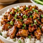 Delicious homemade Bourbon Chicken served with rice and vegetables