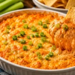 Delicious Buffalo Chicken Dip served in a bowl with celery sticks for dipping.