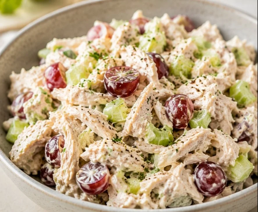 Bowl of easy chicken salad with fresh vegetables and herbs