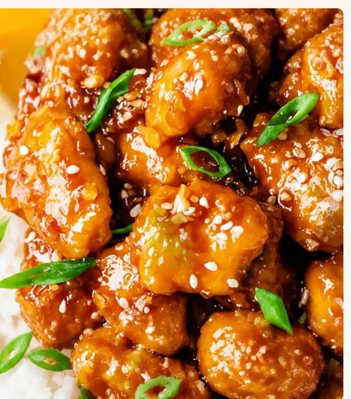 Healthy homemade orange chicken served with vegetables on a plate