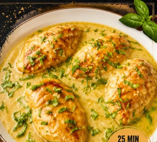 Lemon Basil Chicken dish garnished with fresh herbs and lemon slices.