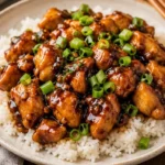 Delicious plate of Mongolian Chicken served with vegetables and rice