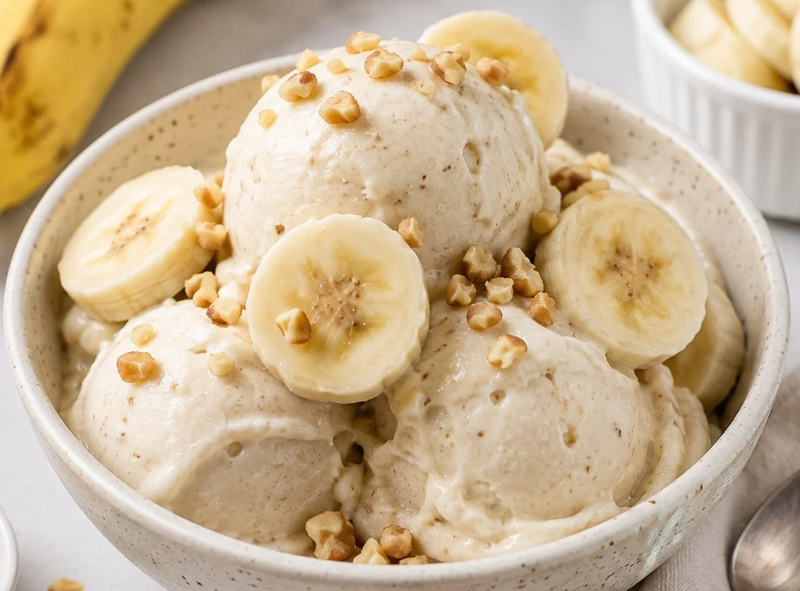 Delicious bowl of homemade banana ice cream topped with fresh banana slices