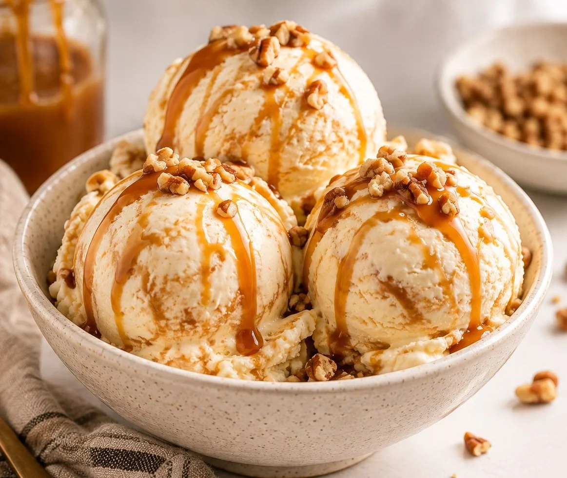 Delicious bowl of caramel ice cream topped with a caramel drizzle