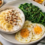 High protein vegetarian breakfast with eggs, greens, and avocado on a plate